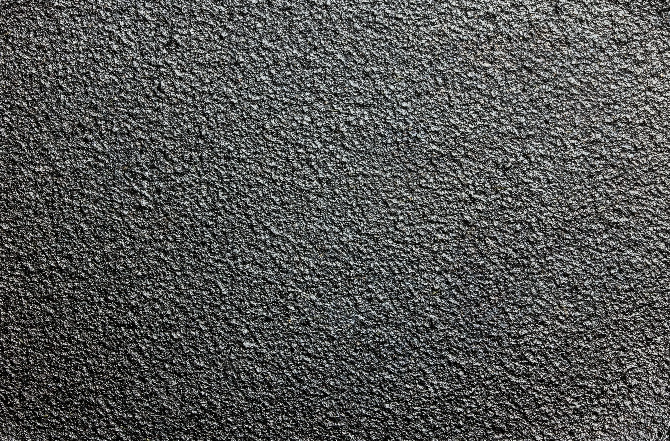 Détail d’une surface de fonte sombre texturée